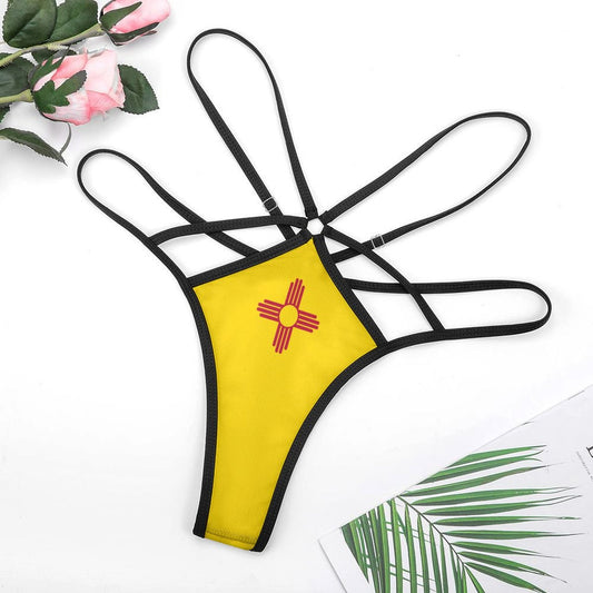 Yellow bikini with straps, [Brand], pink flowers, palm leaf.
