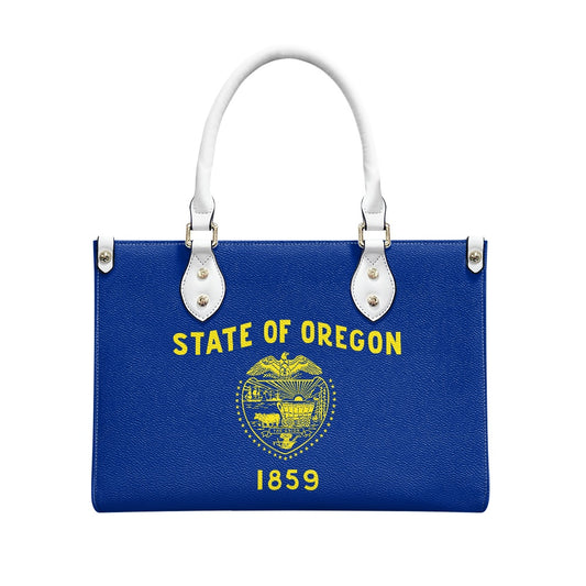 Blue handbag with Oregon state design, white handles, [Brand].