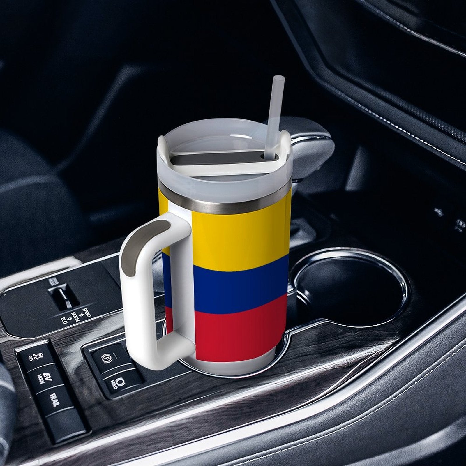 [Brand] mug with Colombian flag in a car holder.