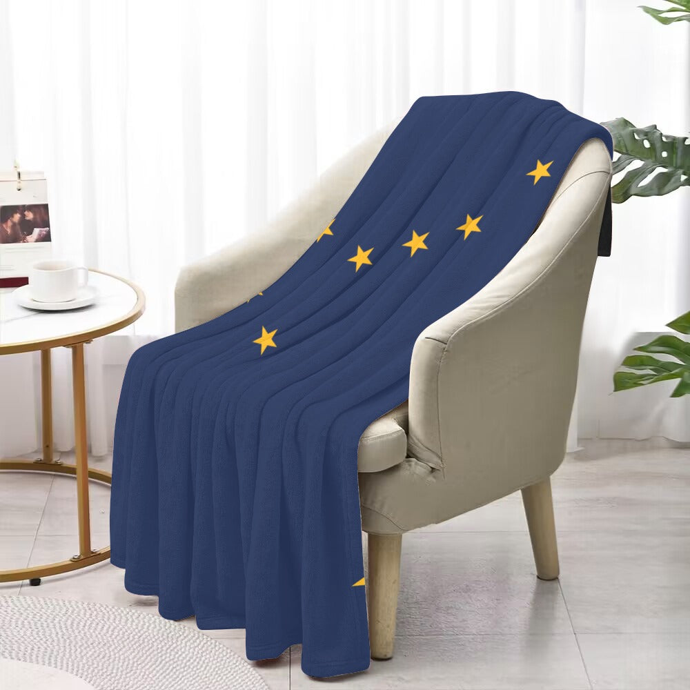 Blue blanket with yellow stars on chair, Luv My Flag.
