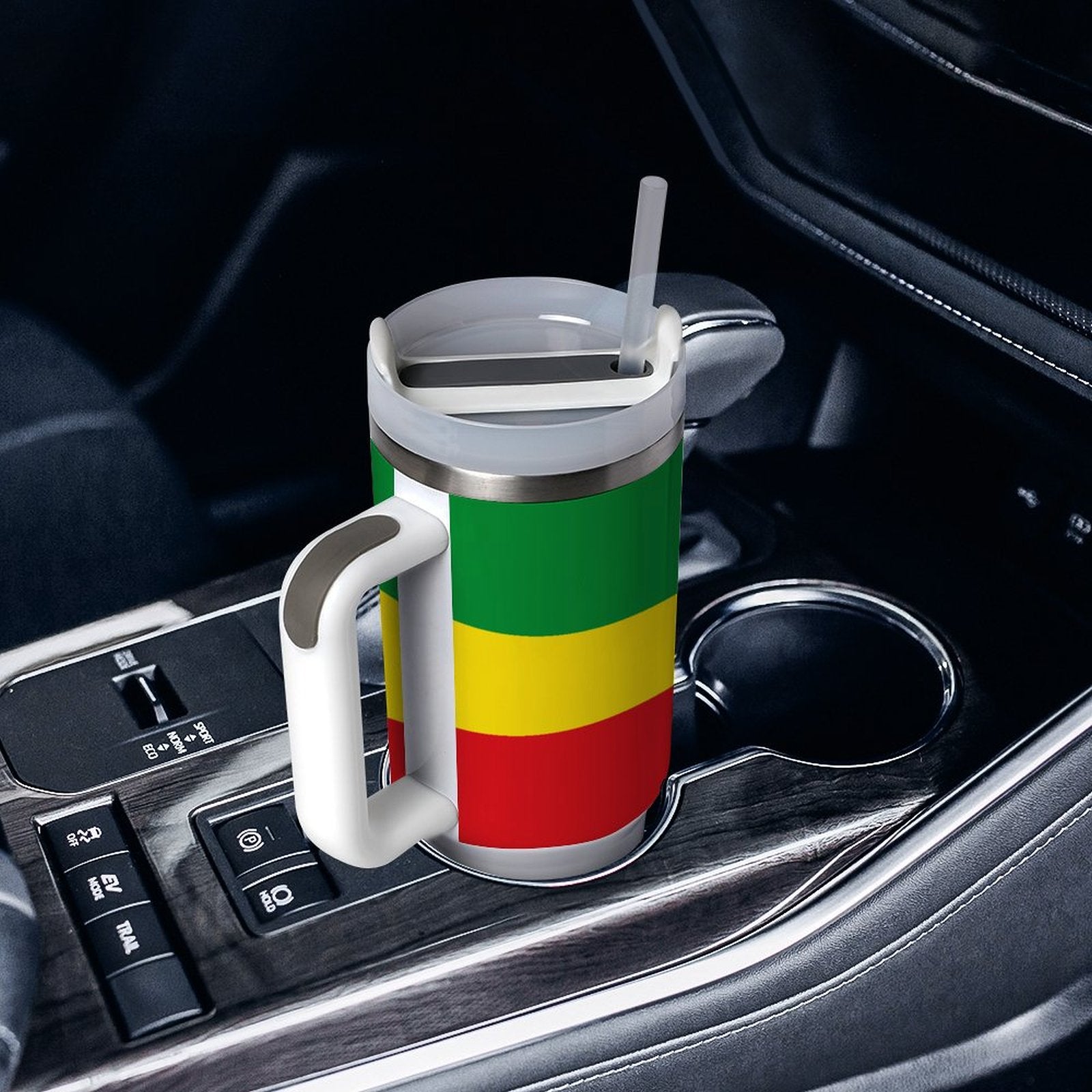 [Brand] travel mug with colorful stripes in car holder.