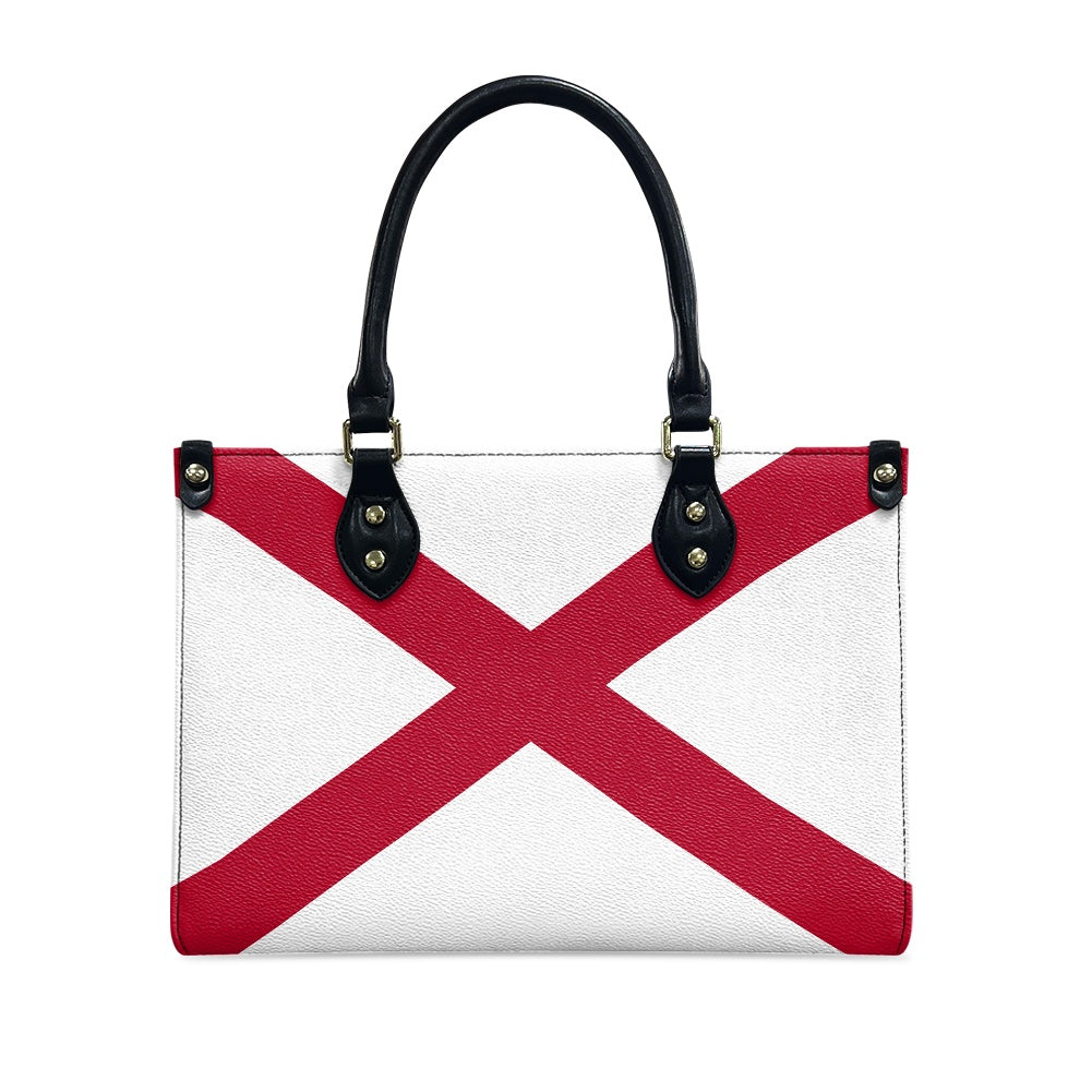 [Brand] handbag featuring bold red cross design, black handles.