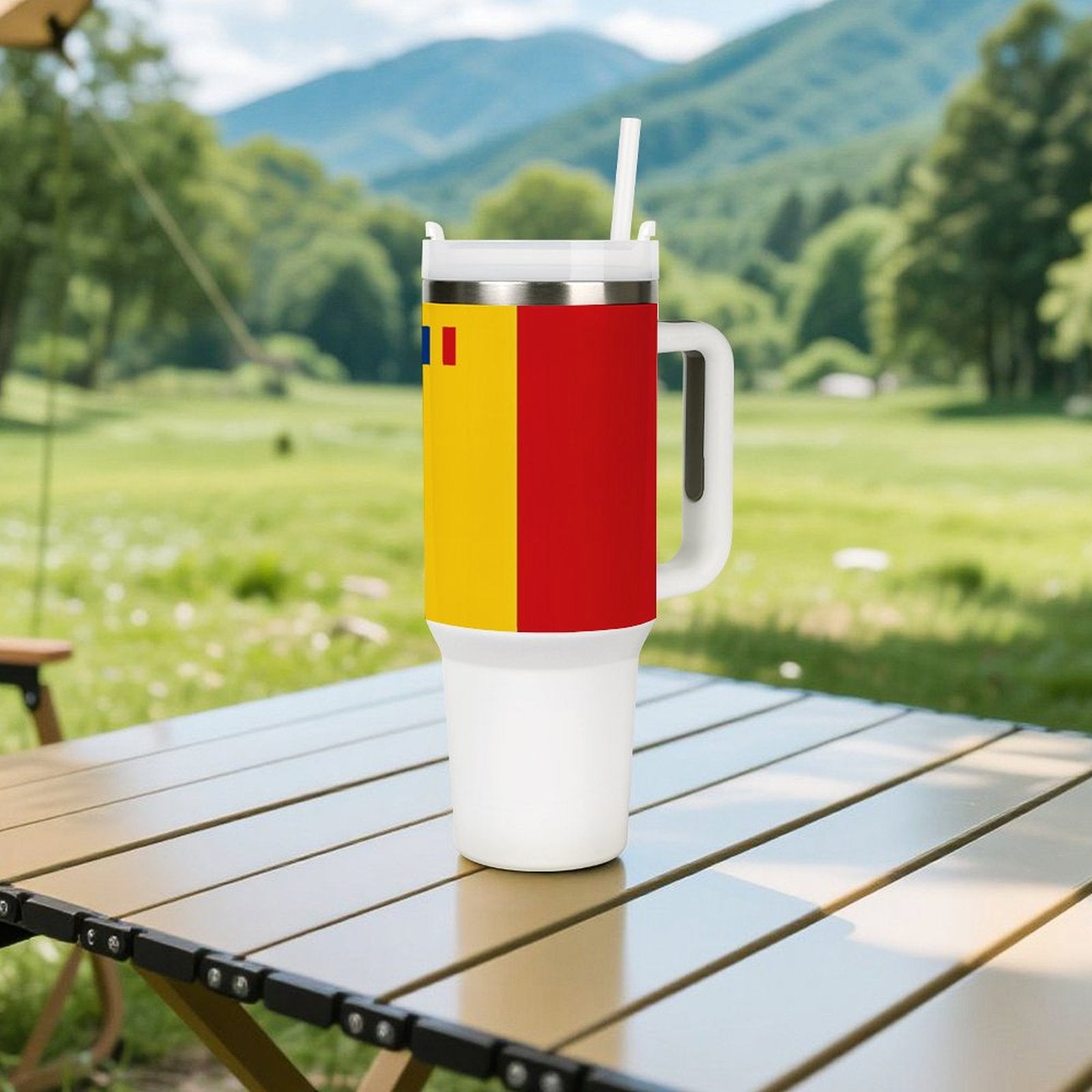 [Brand] vibrant tumbler with straw on outdoor table, mountains.