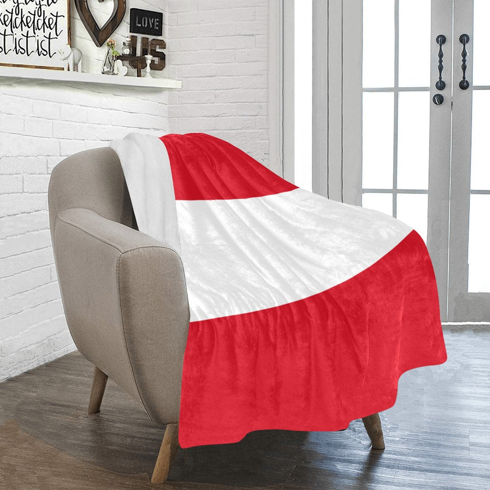 Cozy chair with Luv My Flag red-white throw blanket.