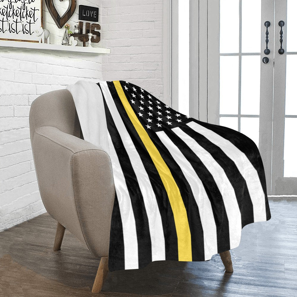 Cozy chair with Luv My Flag black-yellow striped blanket.