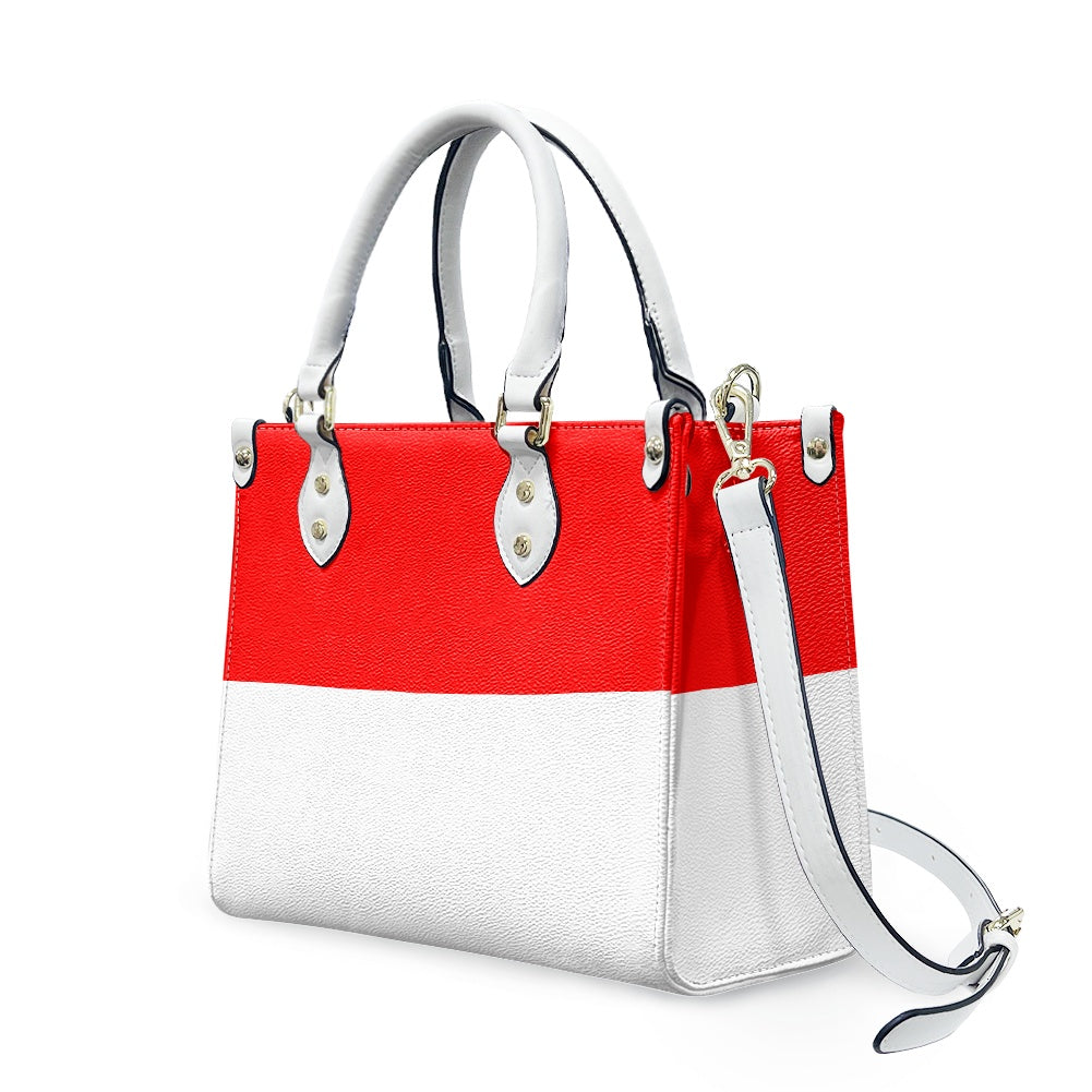 [Brand] red and white handbag with detachable shoulder strap.