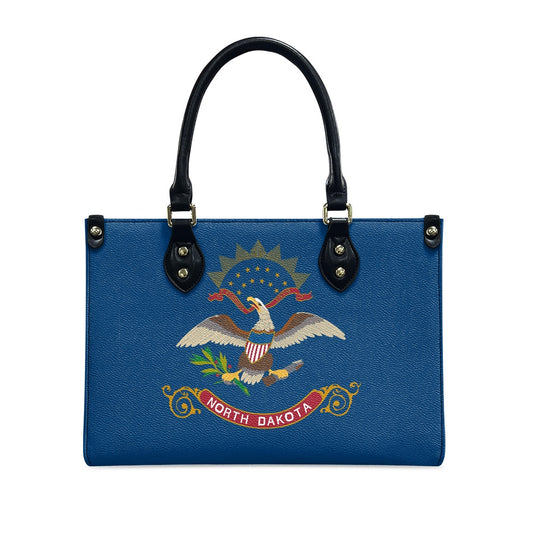 [Brand] handbag featuring North Dakota flag design on blue.