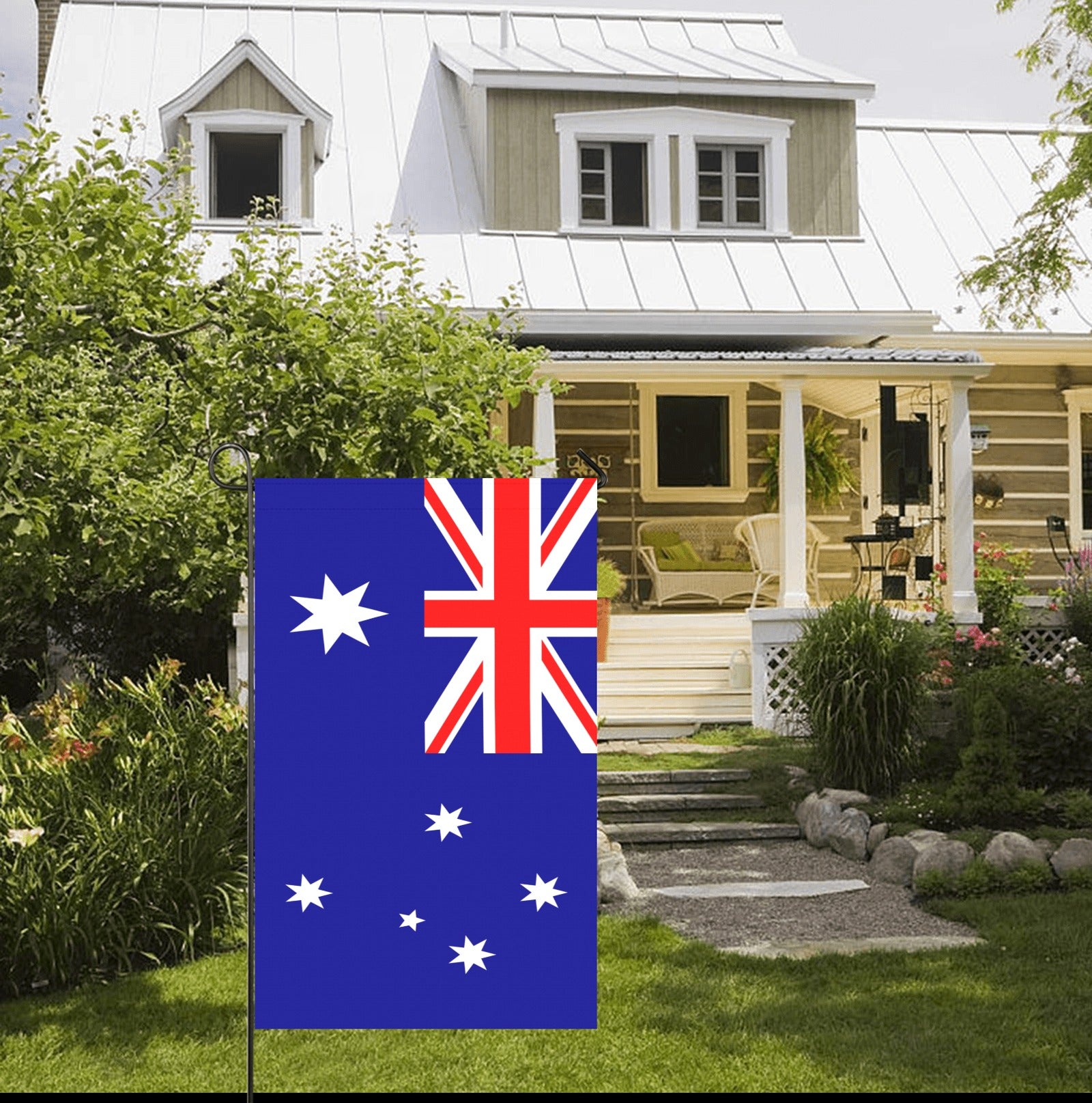[Luv My Flag] Australian flag displayed in yard, cottage backdrop.