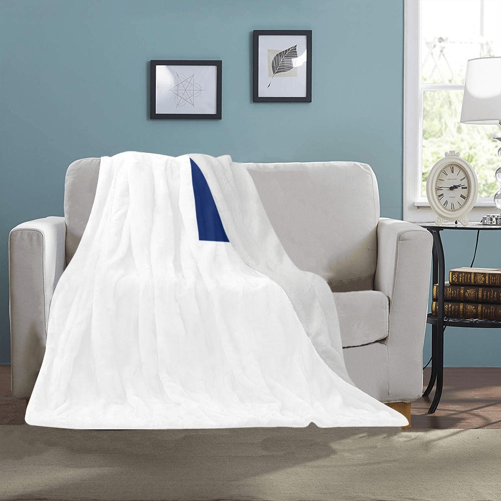 White and blue Luv My Flag blanket on sofa.
