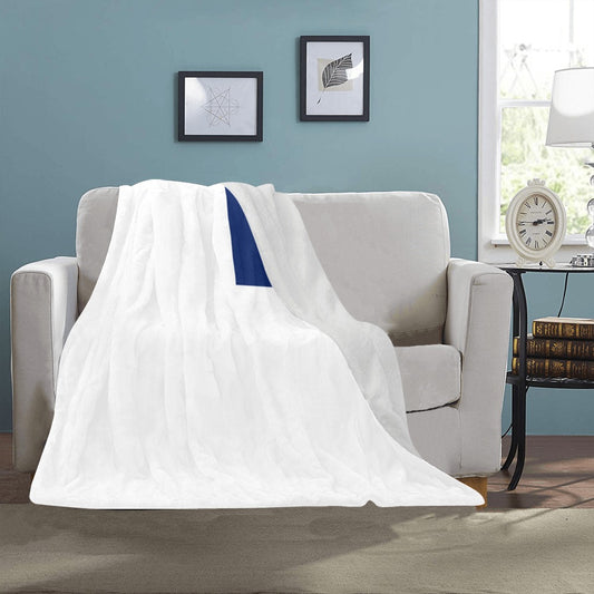 White and blue Luv My Flag blanket on sofa.