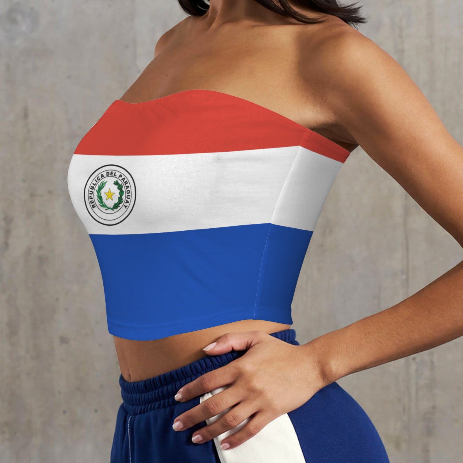 “[Brand] Paraguay flag crop top with blue sweatpants, modeled.”