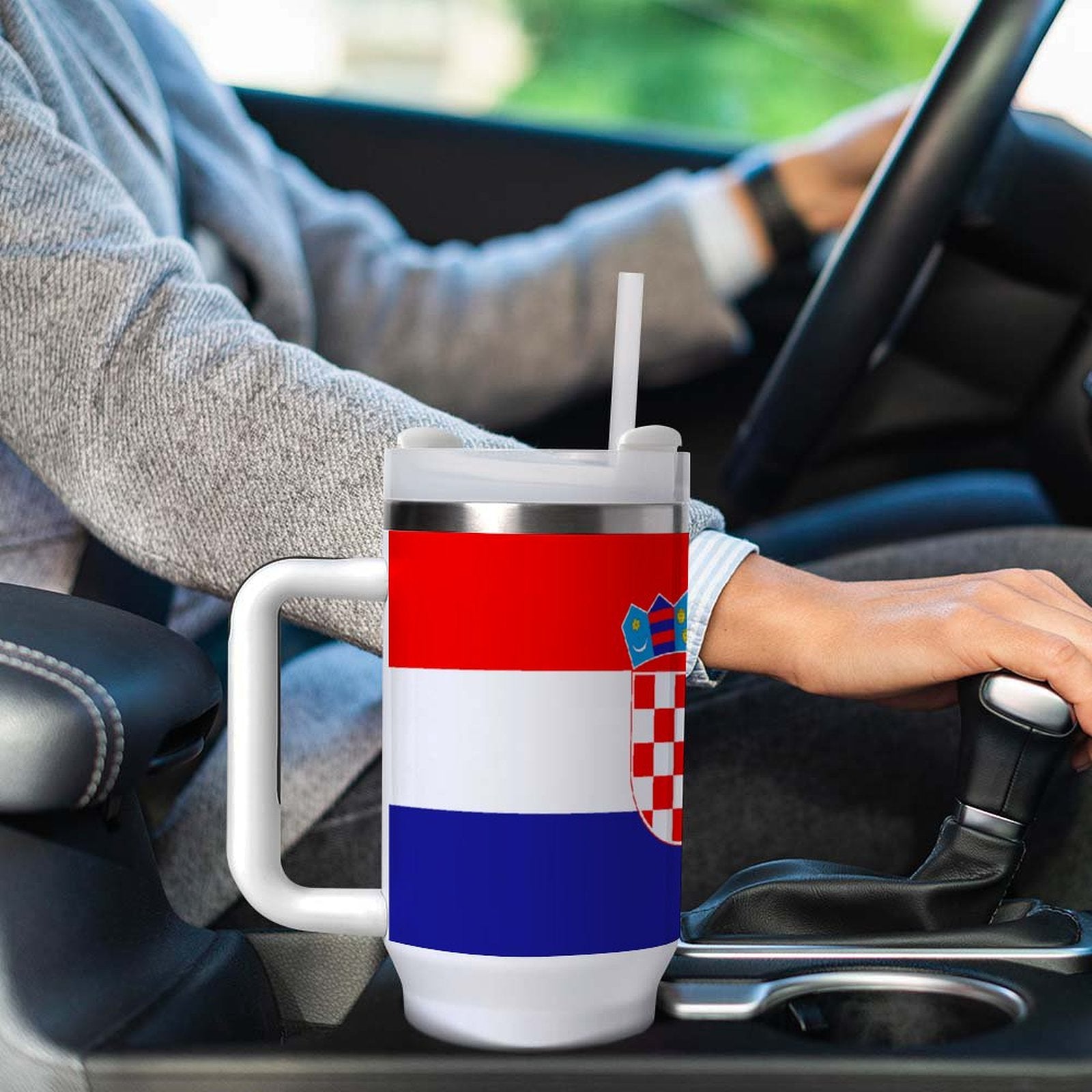[Brand] mug featuring Croatian flag design in car cup holder.