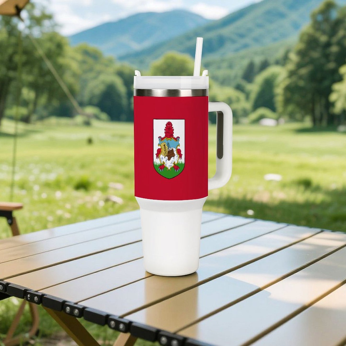 [Brand] mug on outdoor table with scenic mountain background.