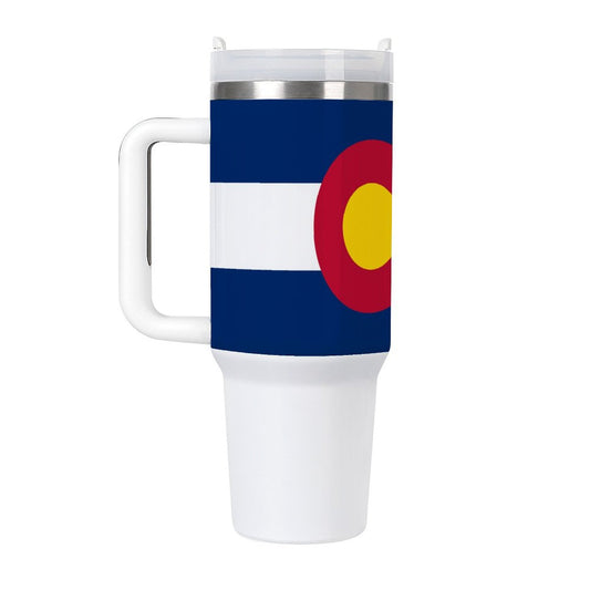 White travel mug featuring Colorado flag design by [Brand].