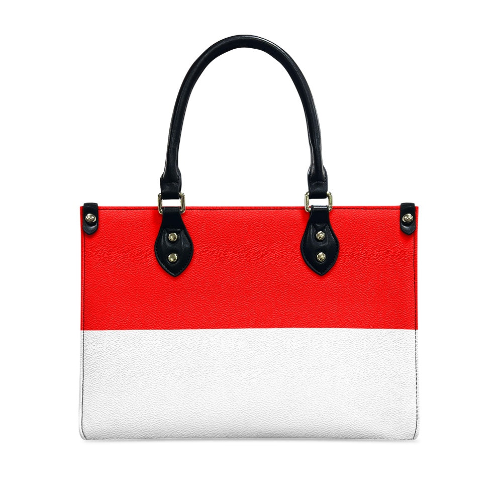 [Brand] red and white handbag with black handles, elegant.