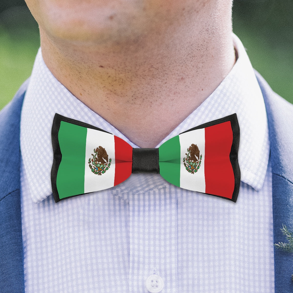 Man wearing [Brand] bow tie with Mexican flag design.