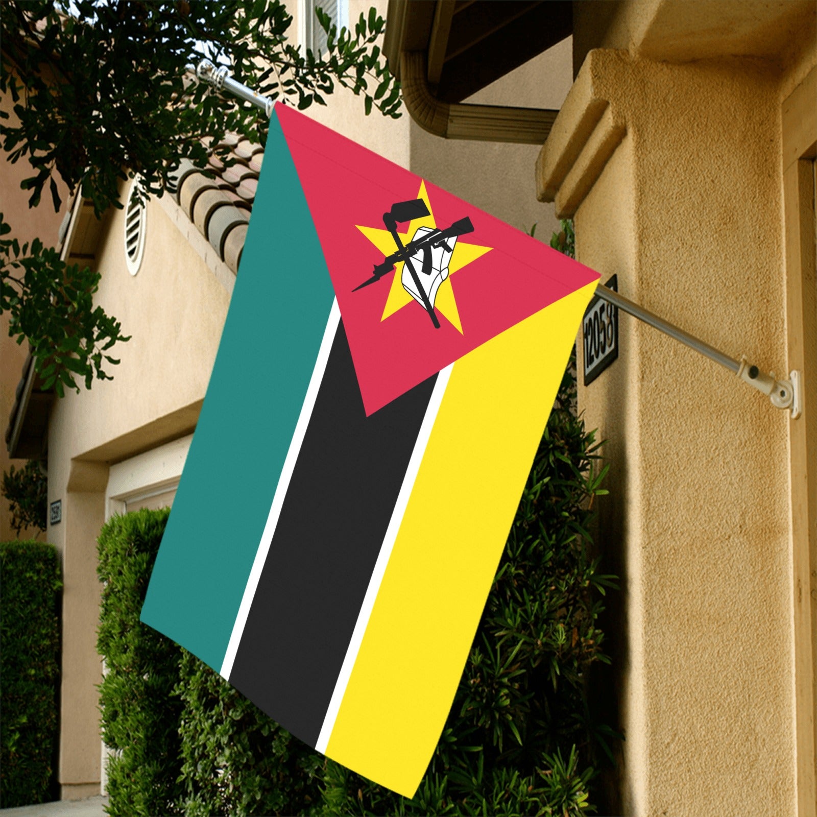 [Luv My Flag] Mozambique flag displayed outside a house.