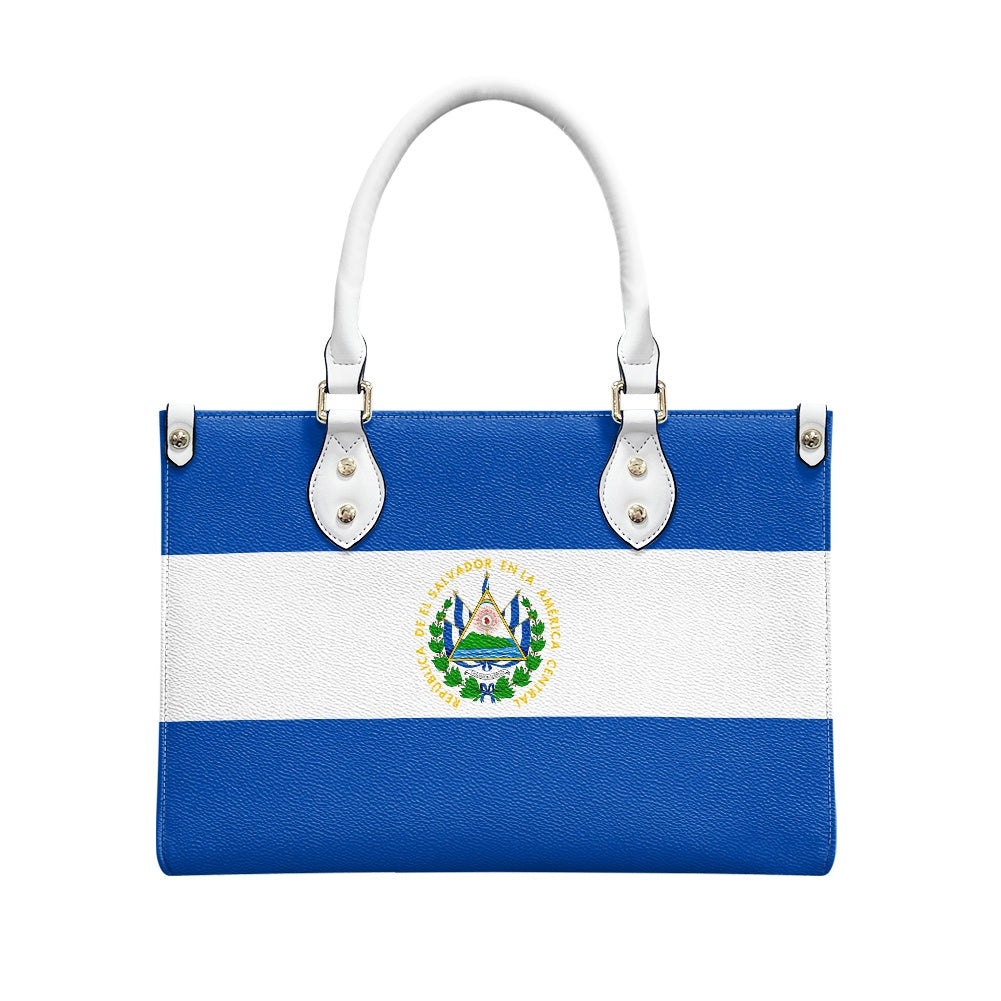 [Brand] handbag with El Salvador flag design, white handles.