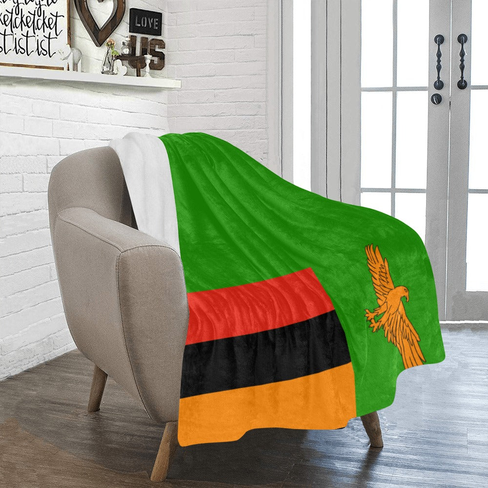 Cozy chair draped with Luv My Flag Zambia blanket.