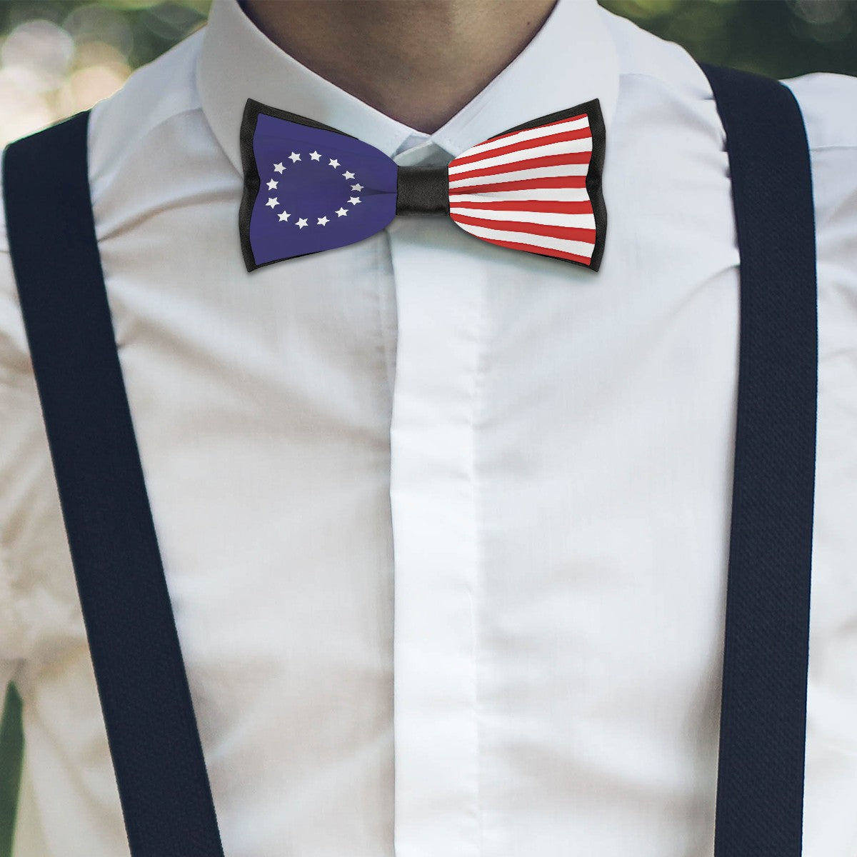 Man wearing [Brand] bow tie with patriotic flag design.
