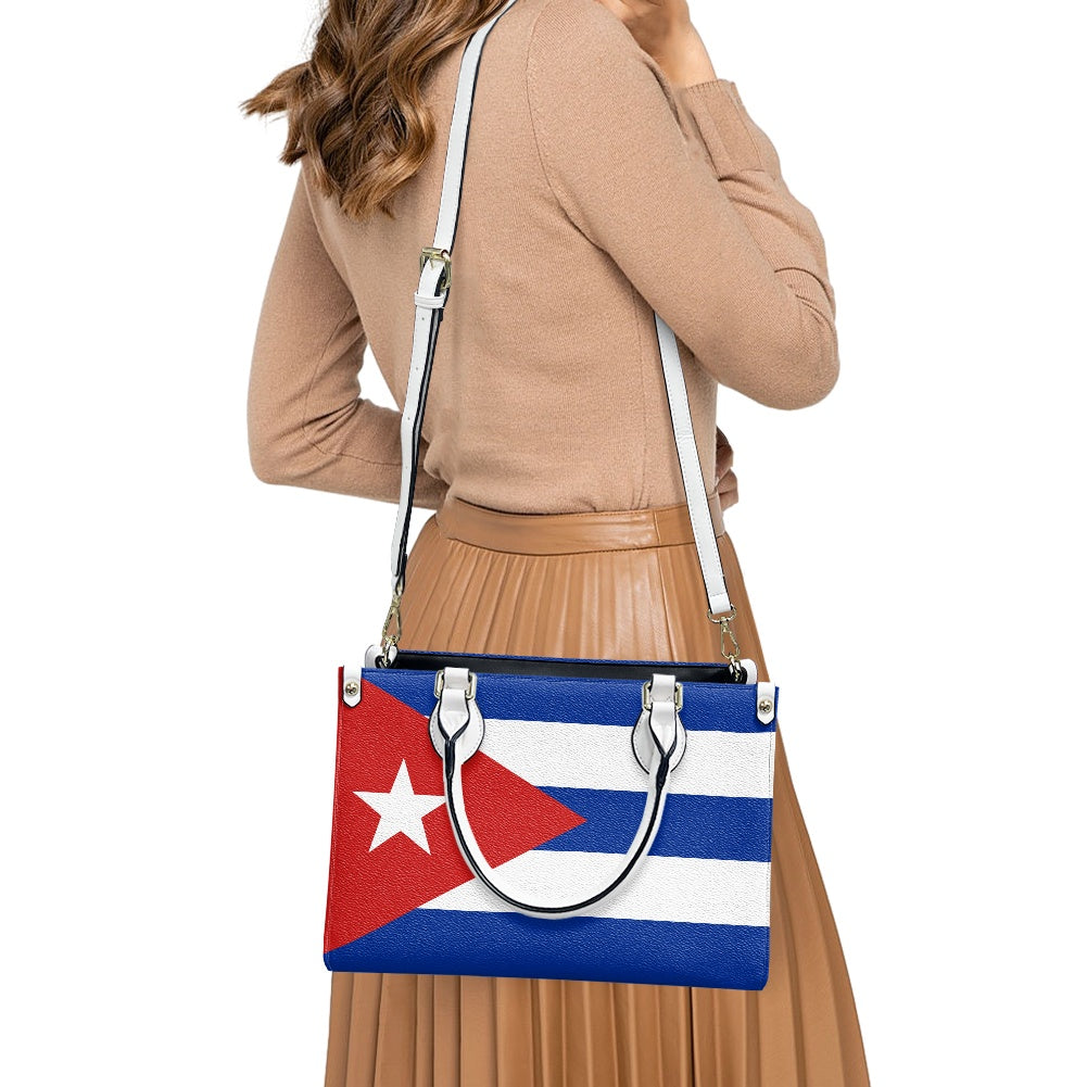 Woman carrying [Brand] handbag with Cuban flag design.