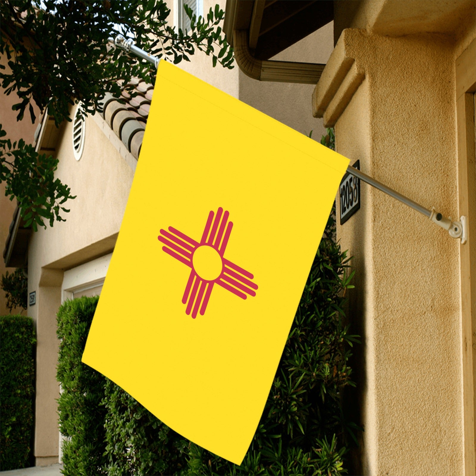 Yellow flag with red symbol hangs outside, Luv My Flag.