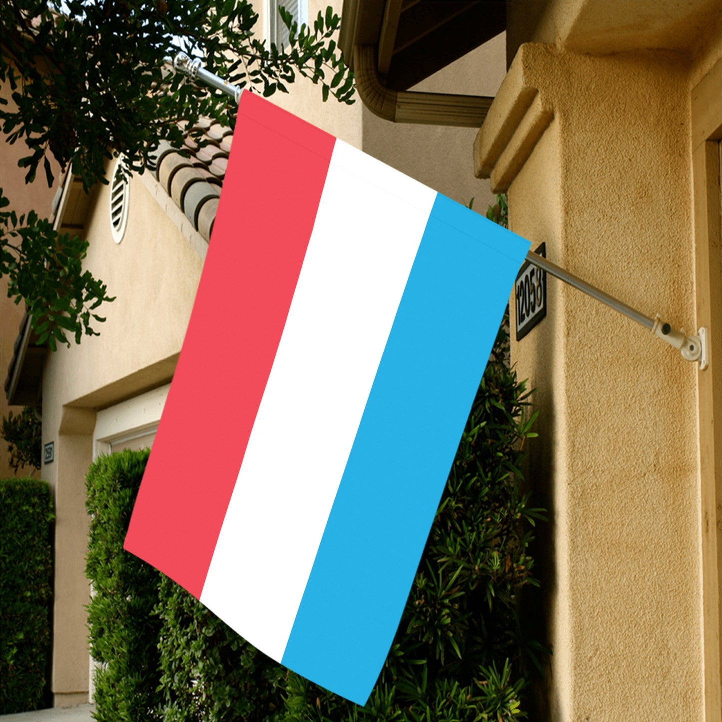 House facade displays Luv My Flag vertically-striped flag.