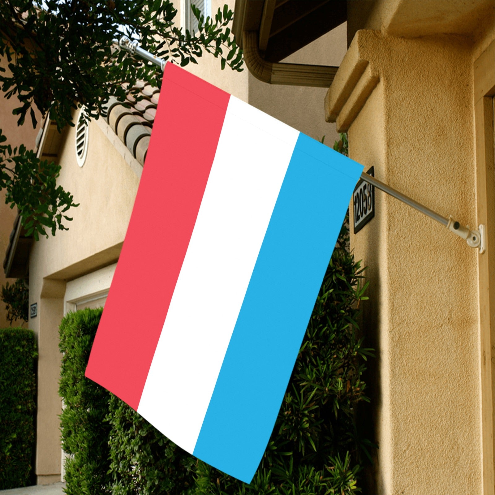 House facade displays Luv My Flag vertically-striped flag.