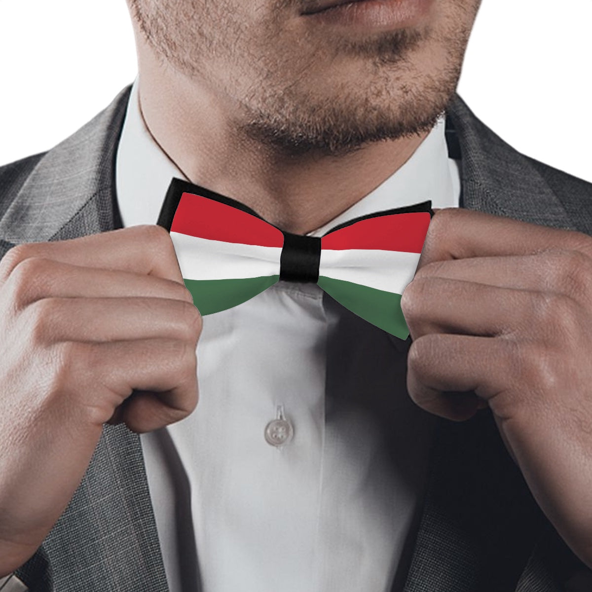 Man adjusting [Brand] bow tie with red, white, green.
