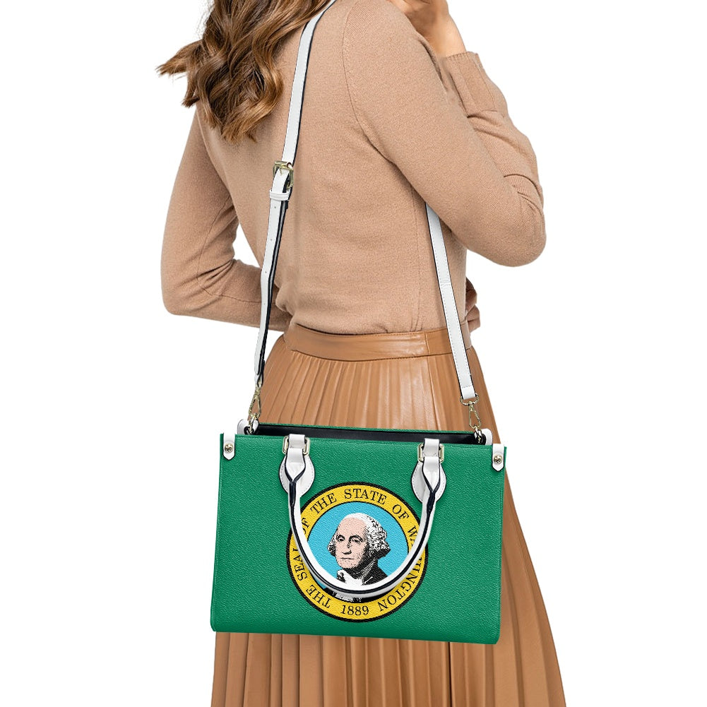 Woman wearing [Brand] green bag with state emblem design.