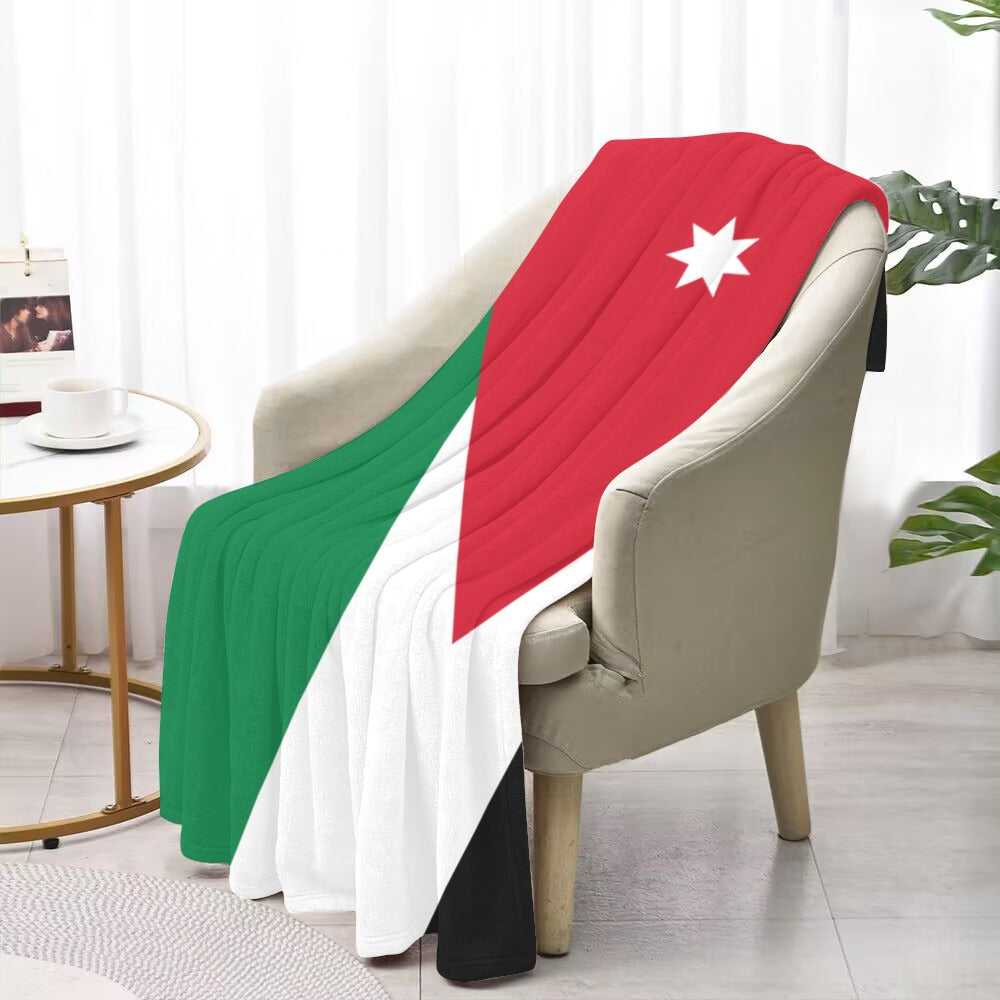 Cozy chair draped with Luv My Flag Jordan blanket.