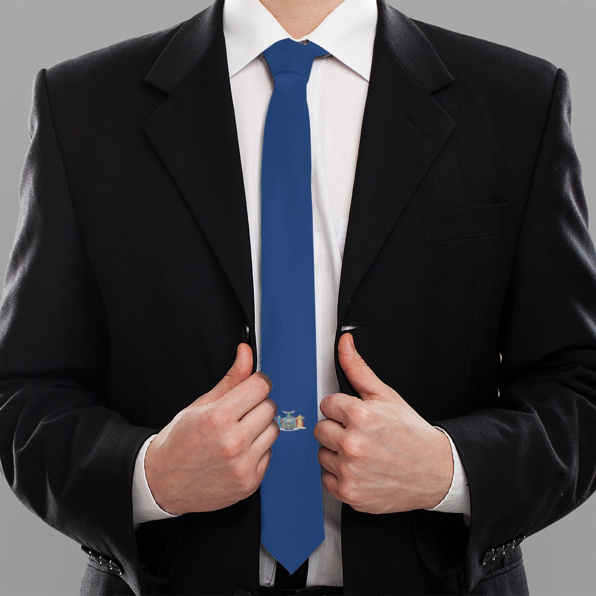 Man in black suit, adjusting [Brand] blue tie.