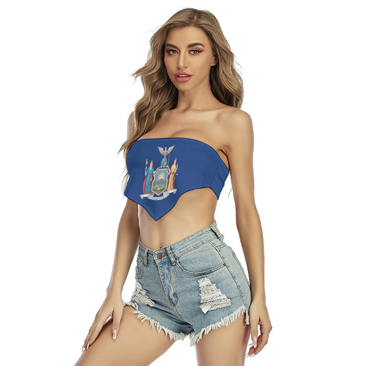 Woman wearing [Brand] blue top and distressed denim shorts.