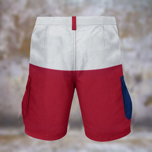 [Brand] shorts with gray, red, and blue color blocks.