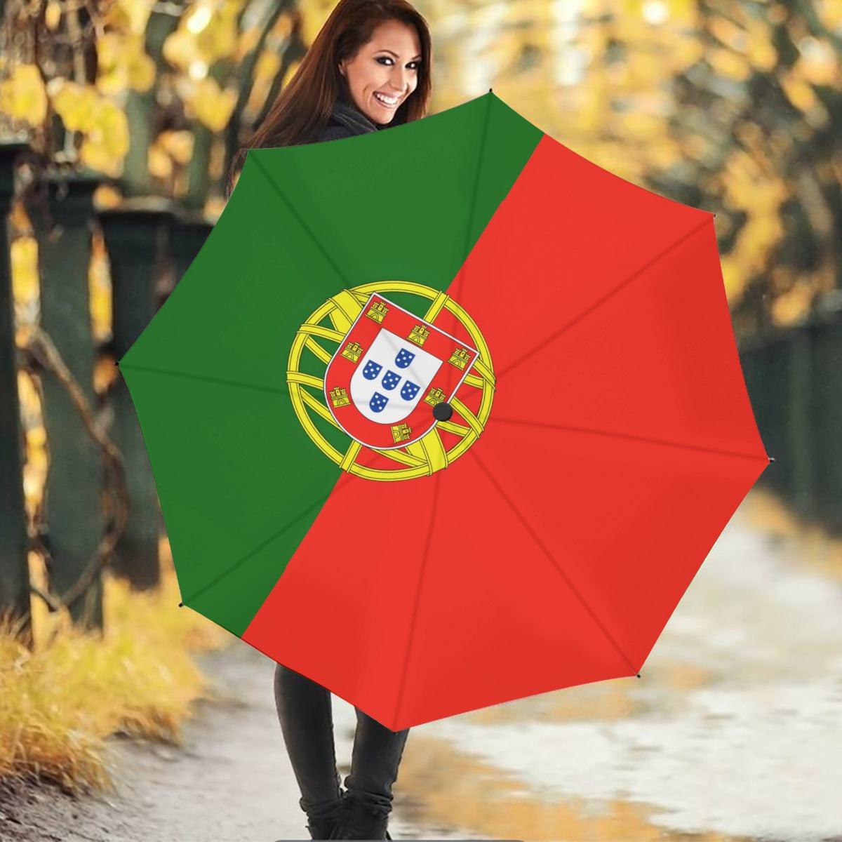 Smiling woman holds umbrella with Portugal flag, outdoors. [Brand]
