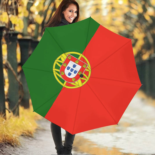 Smiling woman holds umbrella with Portugal flag, outdoors. [Brand]