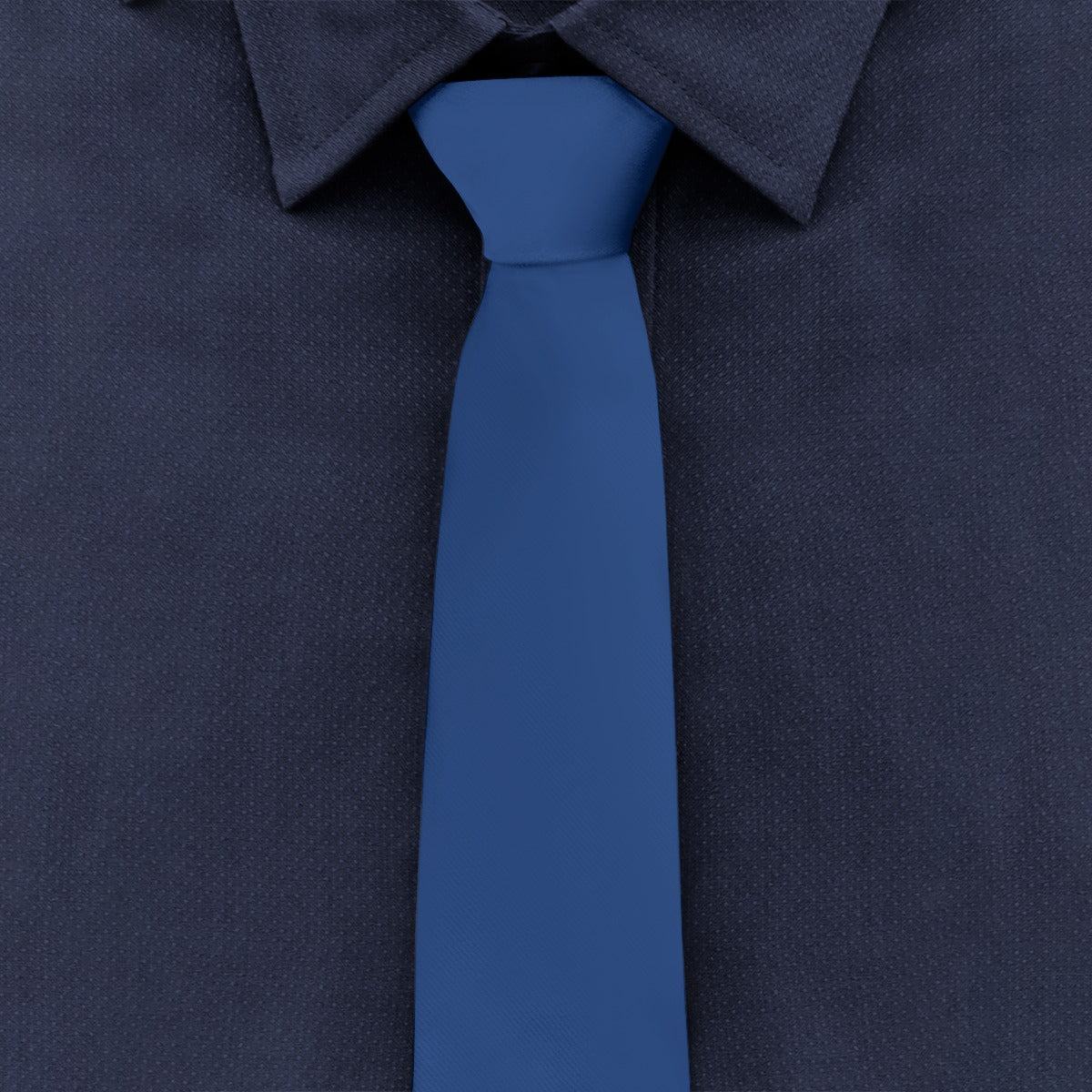A [Brand] blue tie on navy blue dress shirt.