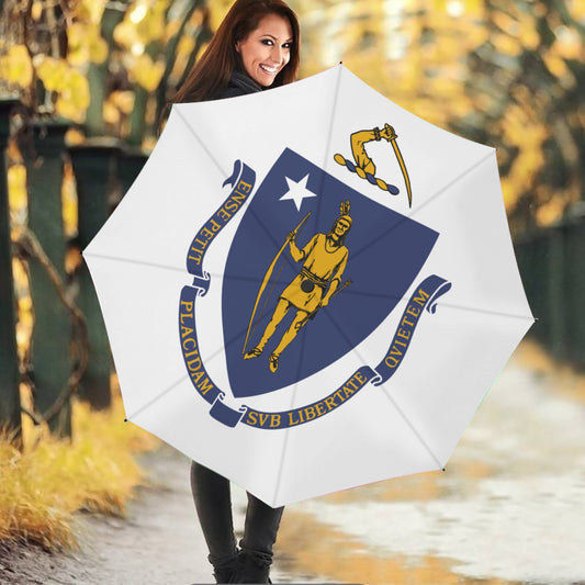 Smiling woman holding [Brand] Massachusetts flag-themed umbrella outdoors.