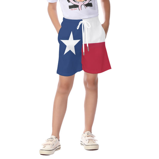 Child wearing [Brand] Texas flag shorts with sneakers.