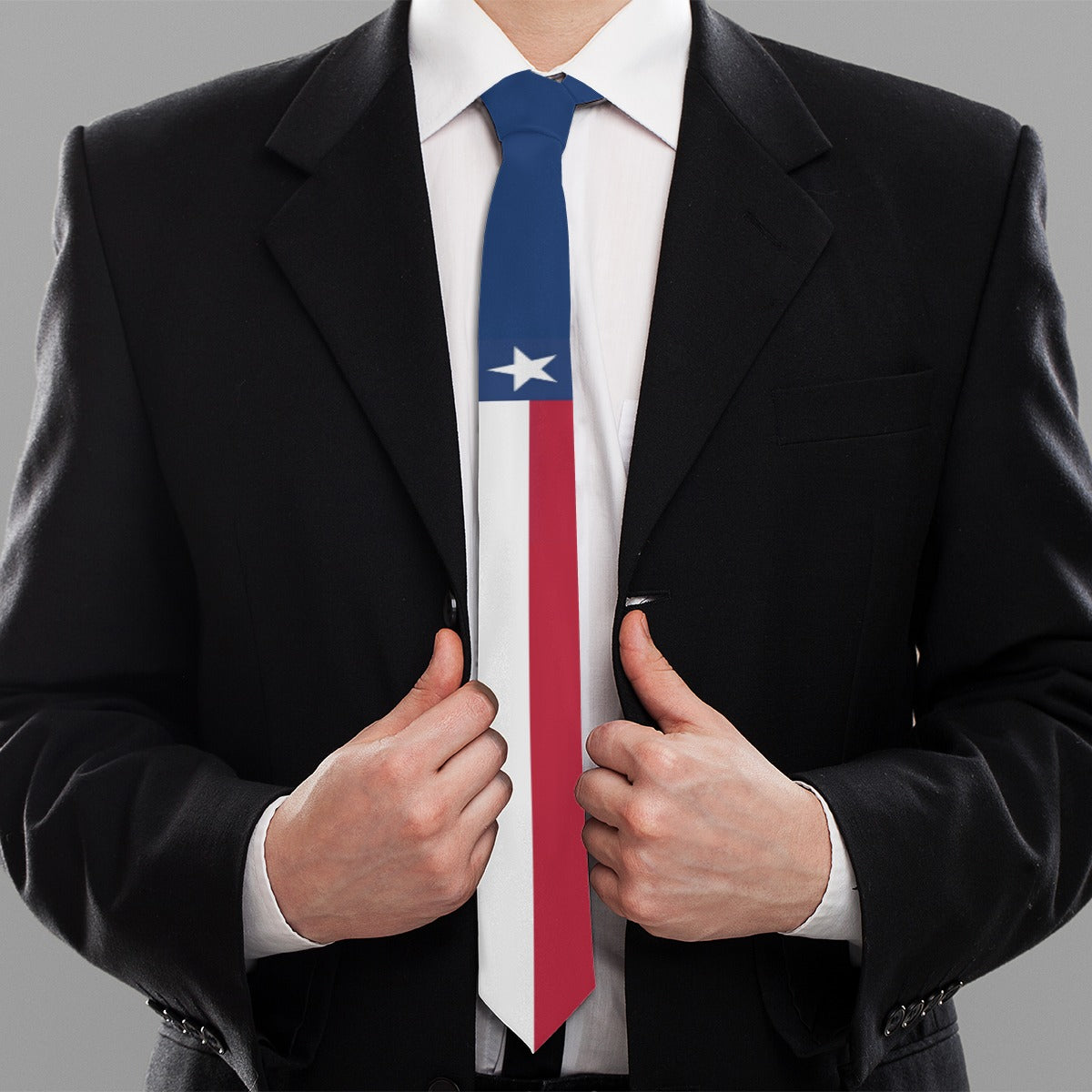 A man wearing a [Brand] suit and Chilean flag tie.