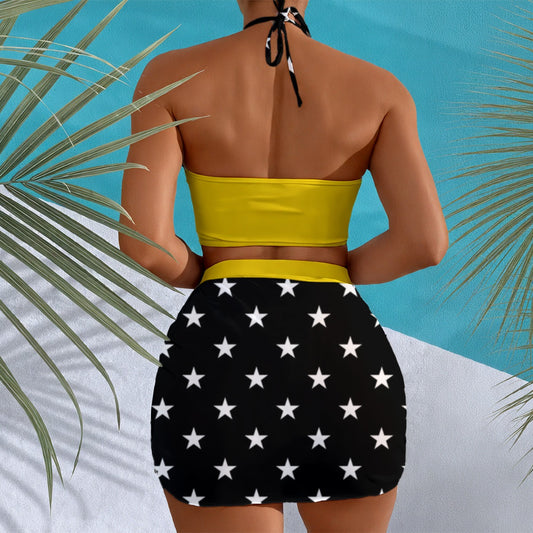 "Luv My Flag swimwear: yellow top, star-patterned skirt, palms."