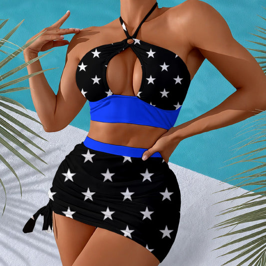 Woman in Luv My Flag star-patterned beachwear, tropical setting.
