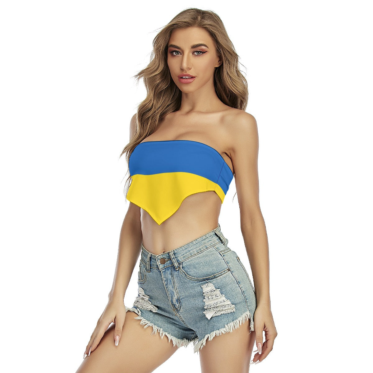 A woman in [Brand] top and distressed denim shorts.