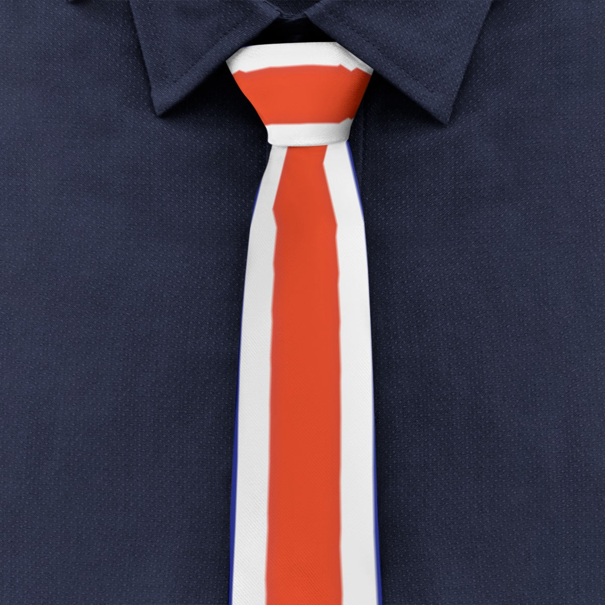 [Brand] red and white striped tie against navy blue shirt.
