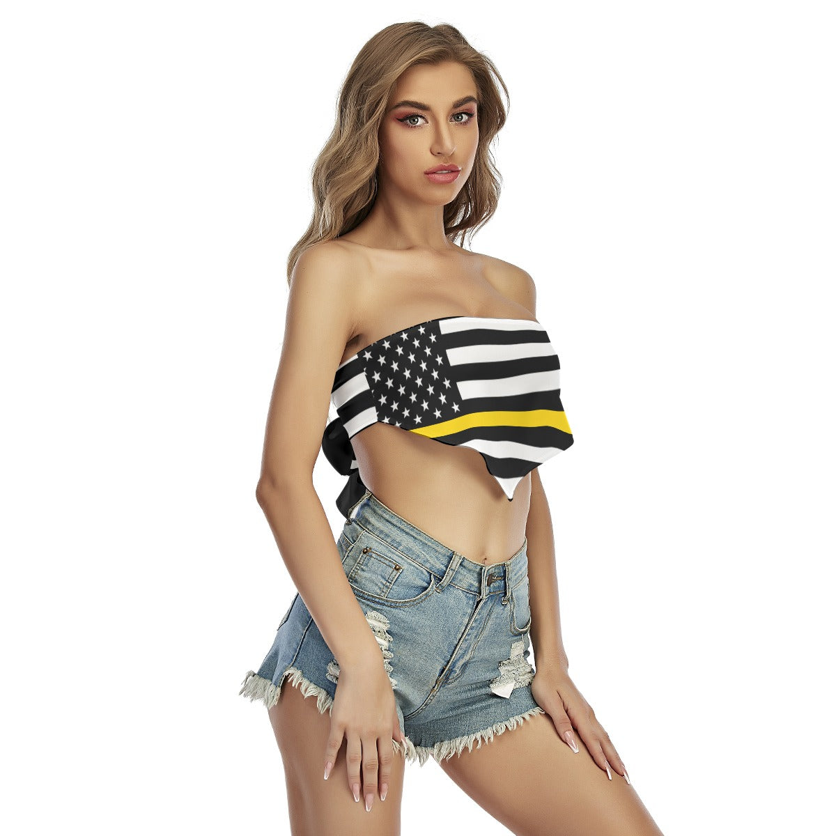 Model wearing [Brand] bandeau top with denim shorts.