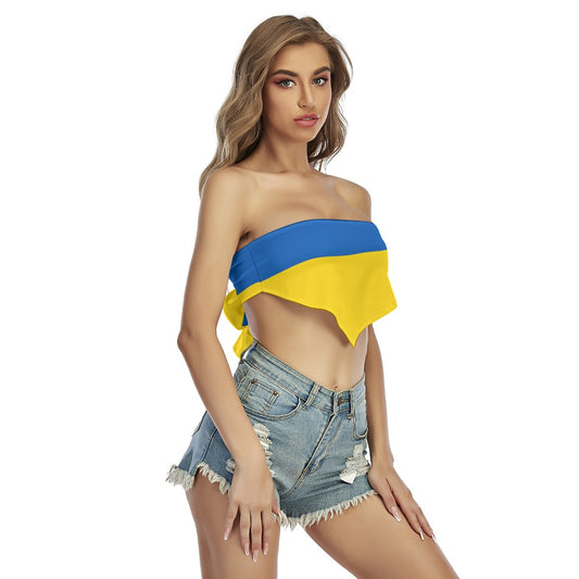 Woman wearing [Brand] blue-yellow top and denim shorts.