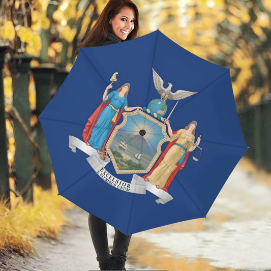 Smiling woman with [Brand] umbrella featuring emblematic design outdoors.