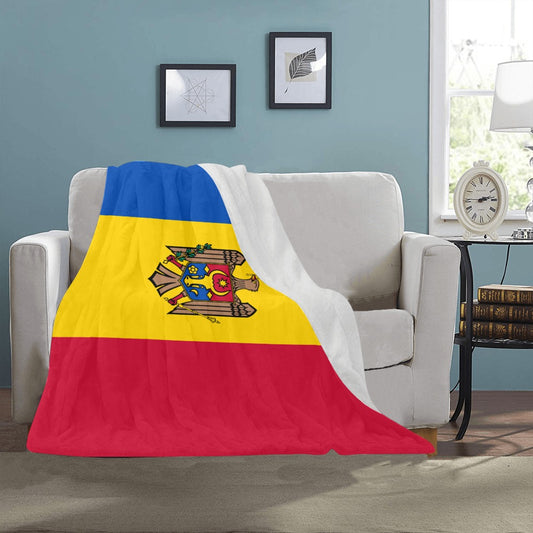 Cozy Luv My Flag blanket draped on beige sofa.