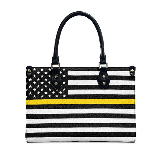 [Brand] handbag with American flag design and yellow stripe.