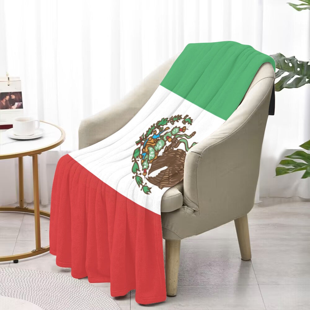 [Luv My Flag] Mexican flag blanket draped over beige chair.